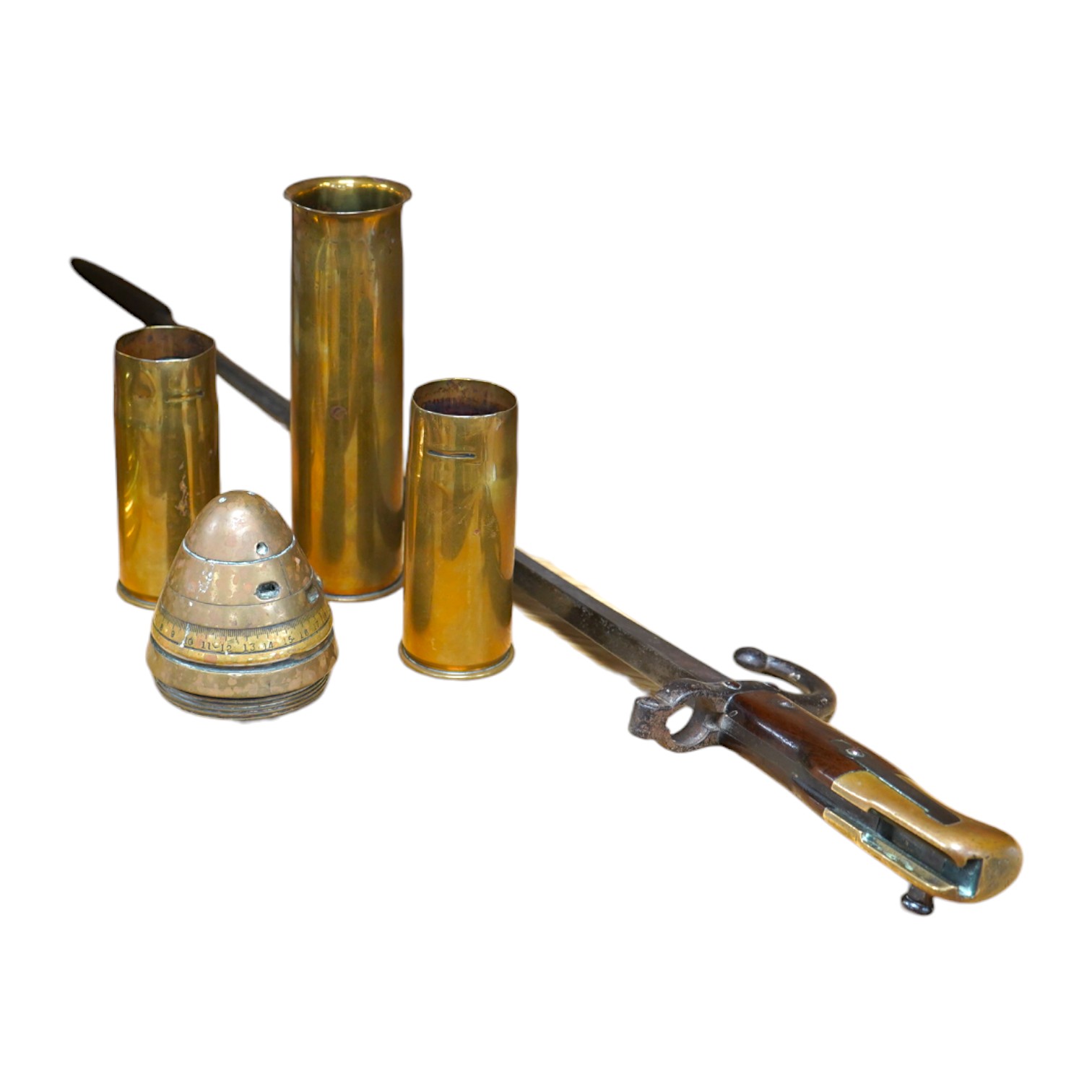 Four pieces of Trench Art and a French bayonet/fire poker. Condition - fair